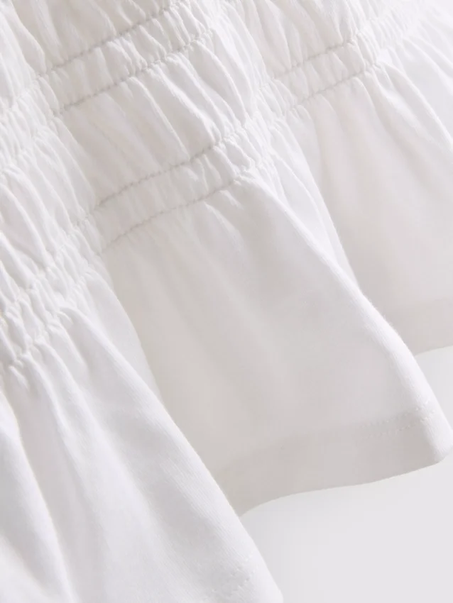 7–15 Jahre | gerafftes Peplum-Hemd
