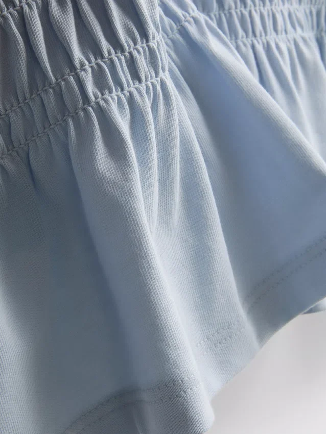7–15 Jahre | gerafftes Peplum-Hemd