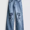 7–15 Jahre | Weite-Jeans mit gestickter Blumen-Schleife