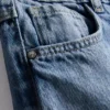 7–15 Jahre | Weite-Jeans mit gestickter Blumen-Schleife