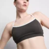 Aktives Crop-Top mit kontrastfarbener Paspelierung und gekreuztem Rücken