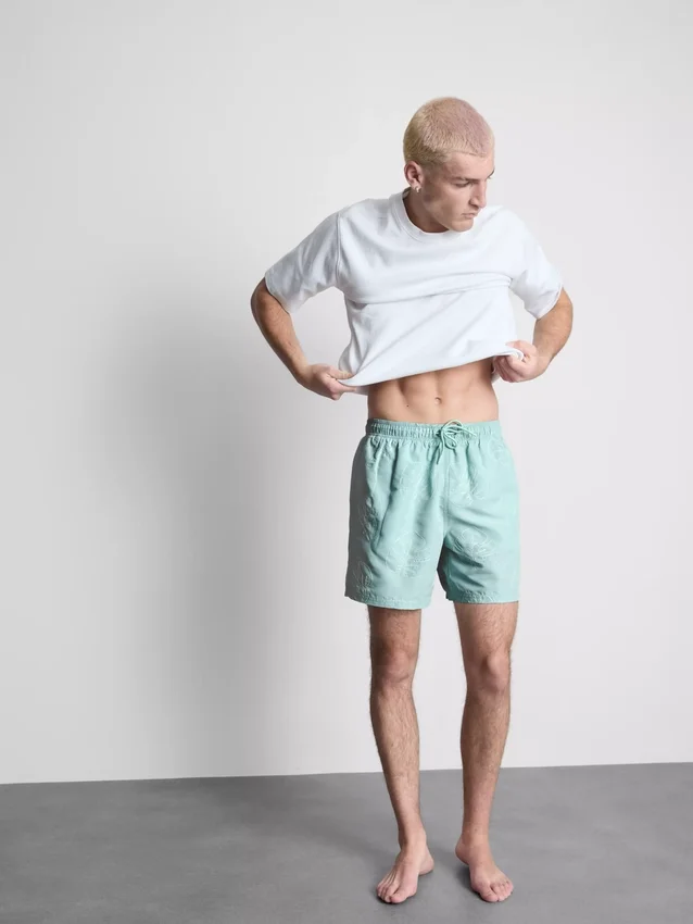 Badeshorts mit Blattstickerei