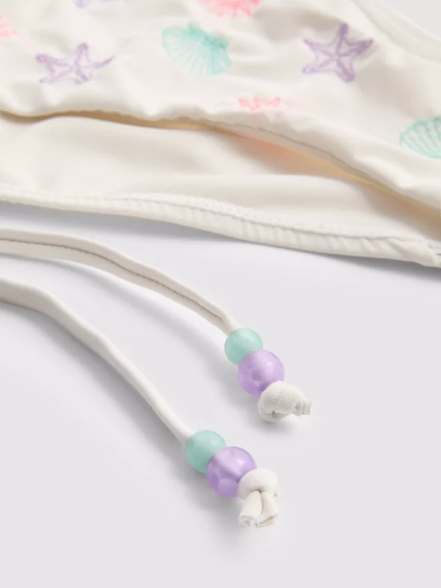 Bikini-Unterteil mit Muschelstickerei und seitlichen Bändern