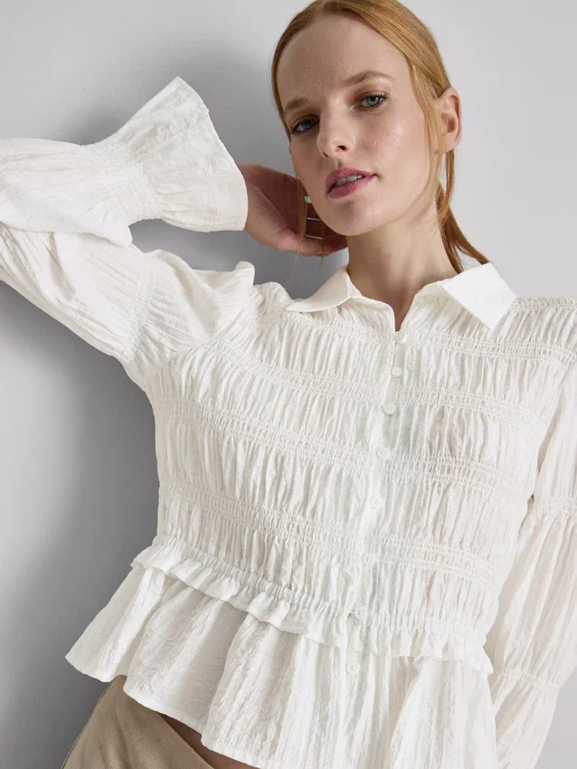 Bluse mit gerafftem Peplum-Saum