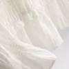 Bluse mit gerafftem Peplum-Saum