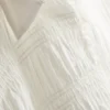 Bluse mit gerafftem Peplum-Saum
