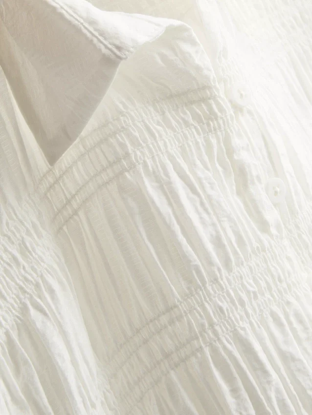 Bluse mit gerafftem Peplum-Saum