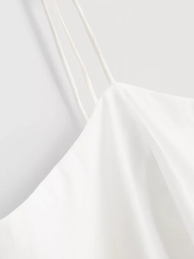 Cami-Top aus Baumwolle mit besticktem Peplum-Saum