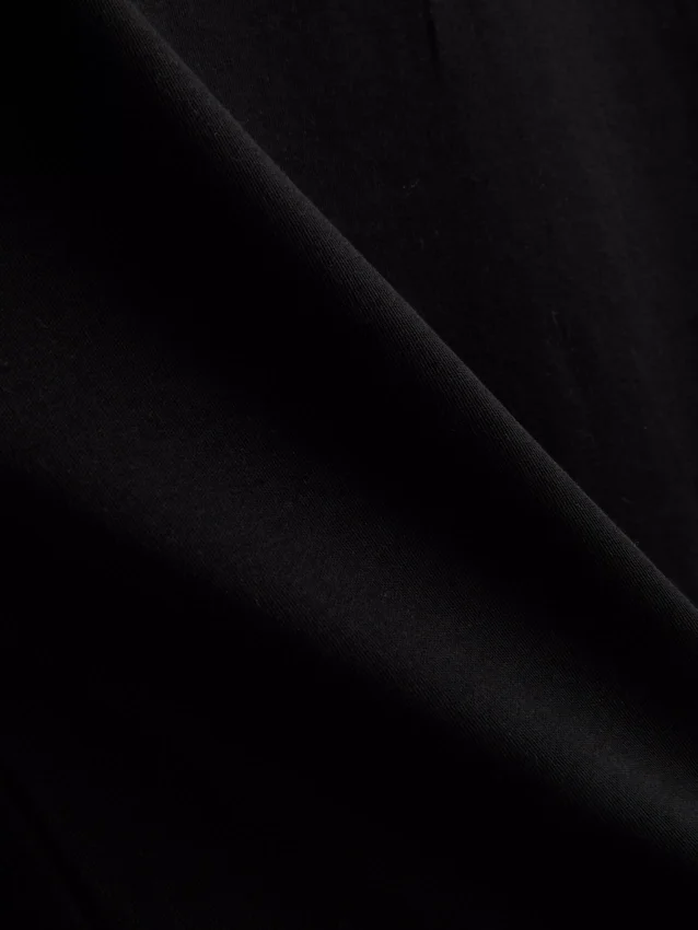 Kurzes, ärmelloses T-Shirt mit Schulterpolstern