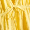 Minikleid aus Baumwolle mit Stufenschnitt und V-Ausschnitt