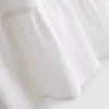 Minikleid aus Baumwolle mit Stufenschnitt und V-Ausschnitt