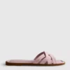 Mules mit geflochtenen Riemen
