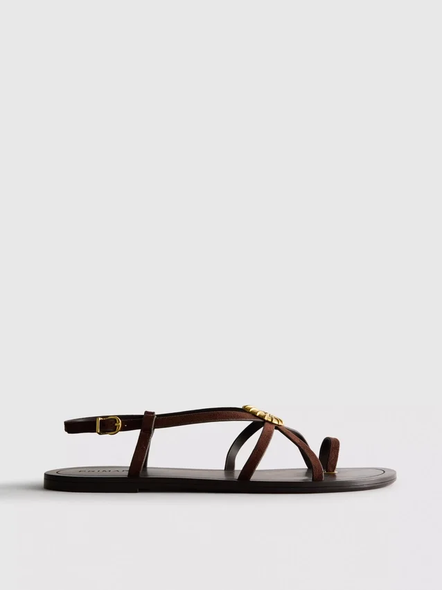 Paula Echevarría Riemchensandalen mit Seestern-Motiv