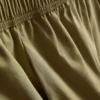 Plissierte Hosen mit weitem Bein in Papieroptik