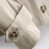 Zweireihige, kastenförmige Regenjacke